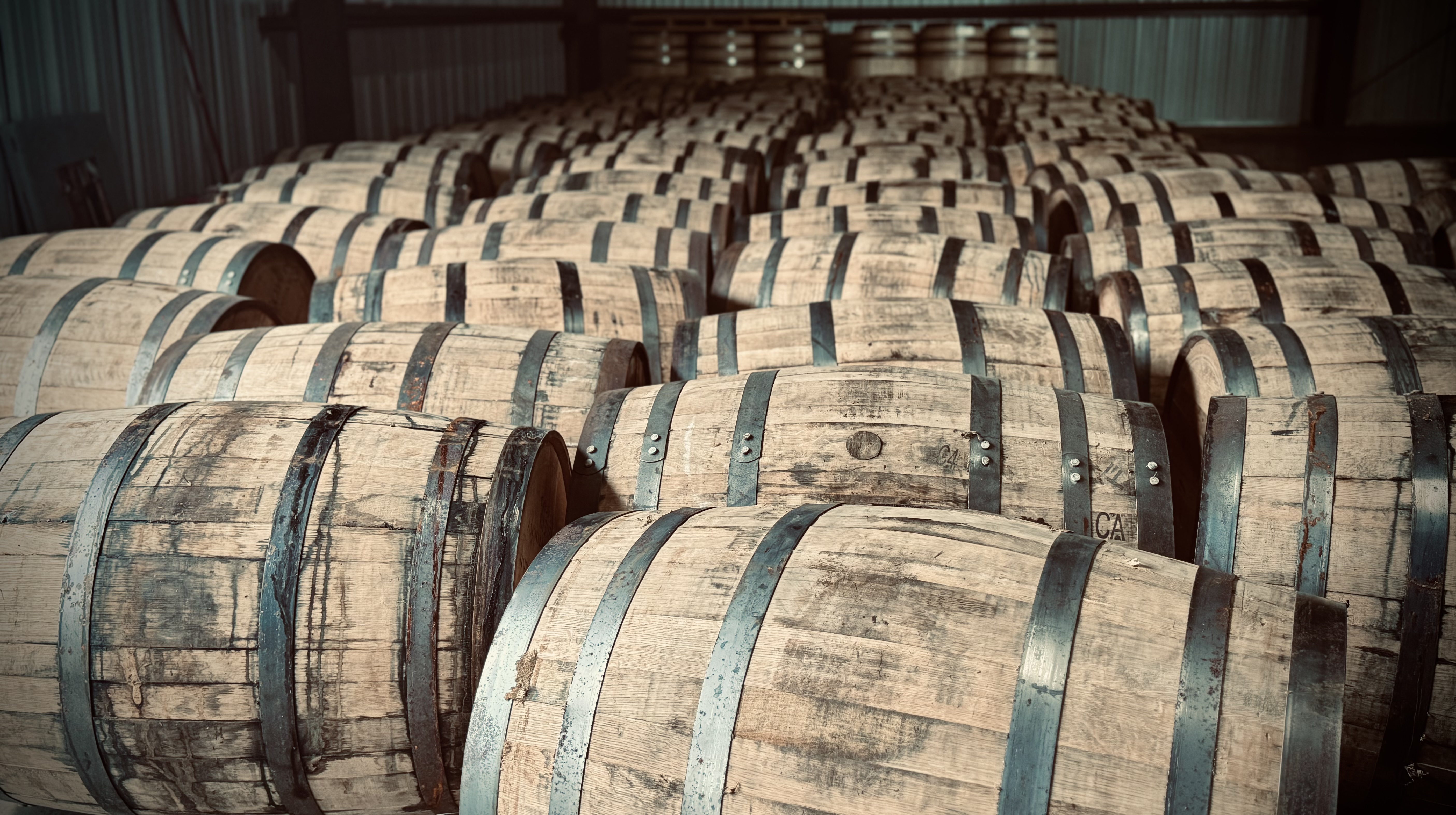 Bourbon barrels aging in a Kentucky warehouse